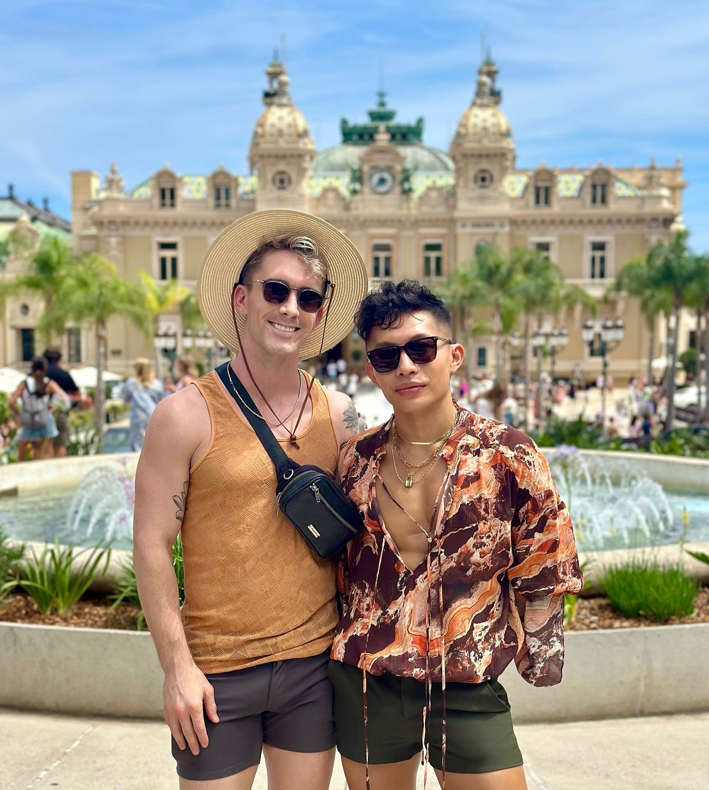 Mark in a straw hat and Beatus in a marbled silk shirt in front of the Monte Carlo Casino fountain